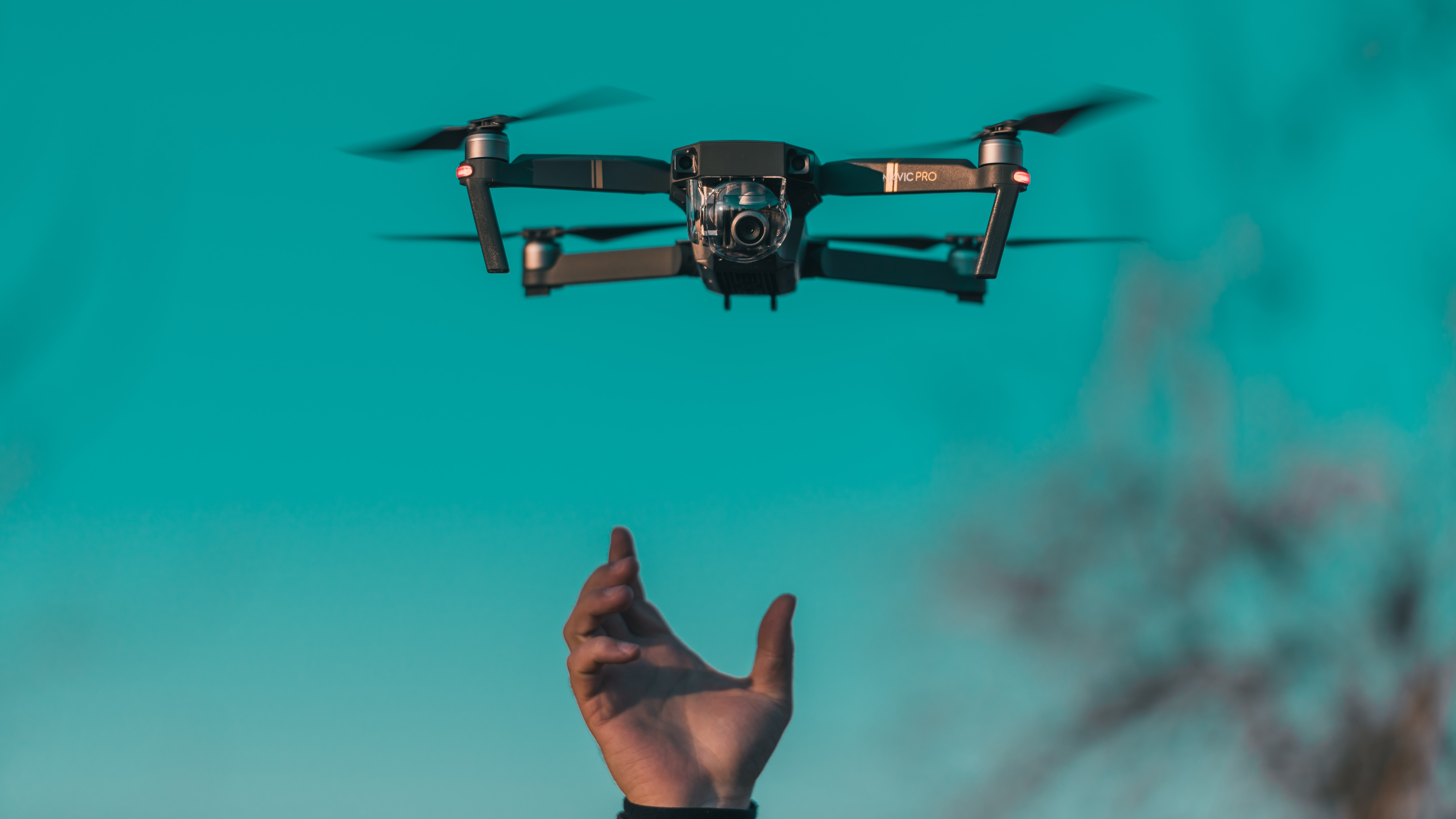 Green Span Using Drones at Construction Sites Hand Reaching for Drone