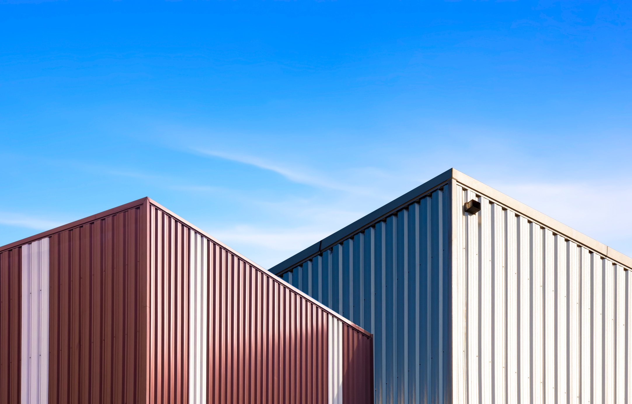 Modern brown and silver corrugated steel industrial buildings