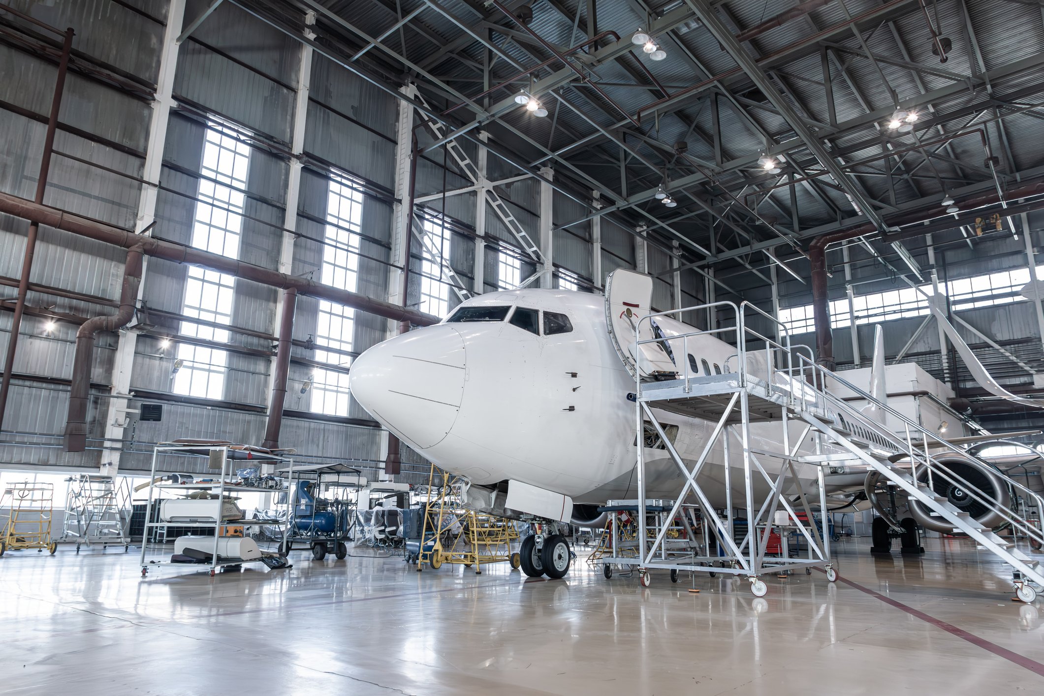 White passenger plane in the airplane hangar