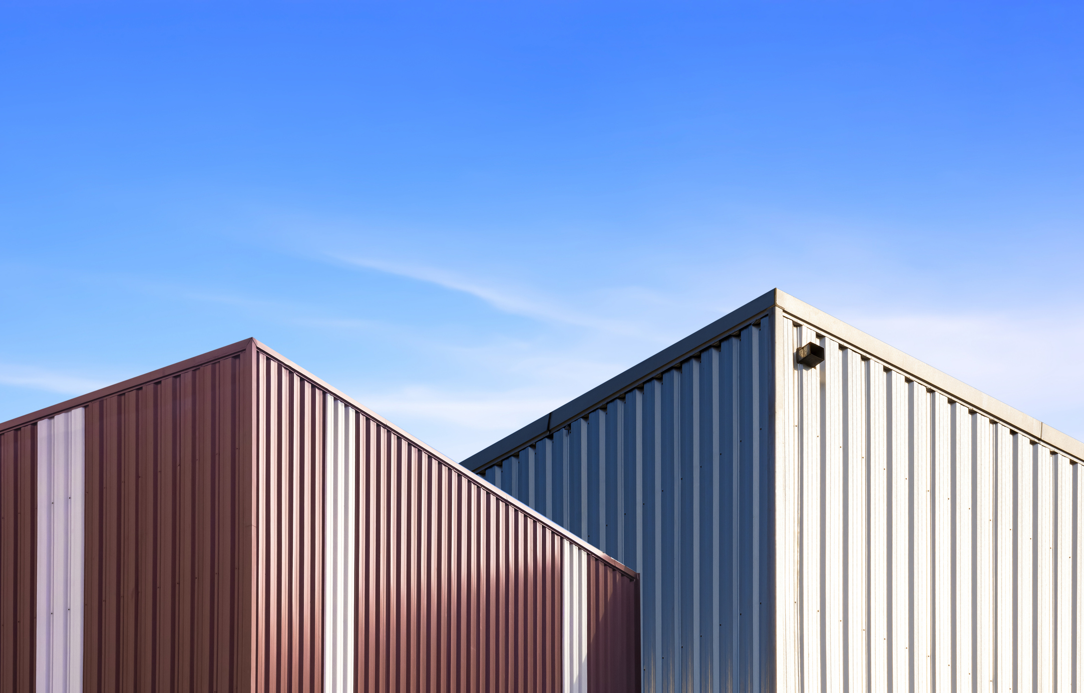 Modern brown and silver corrugated steel industrial buildings