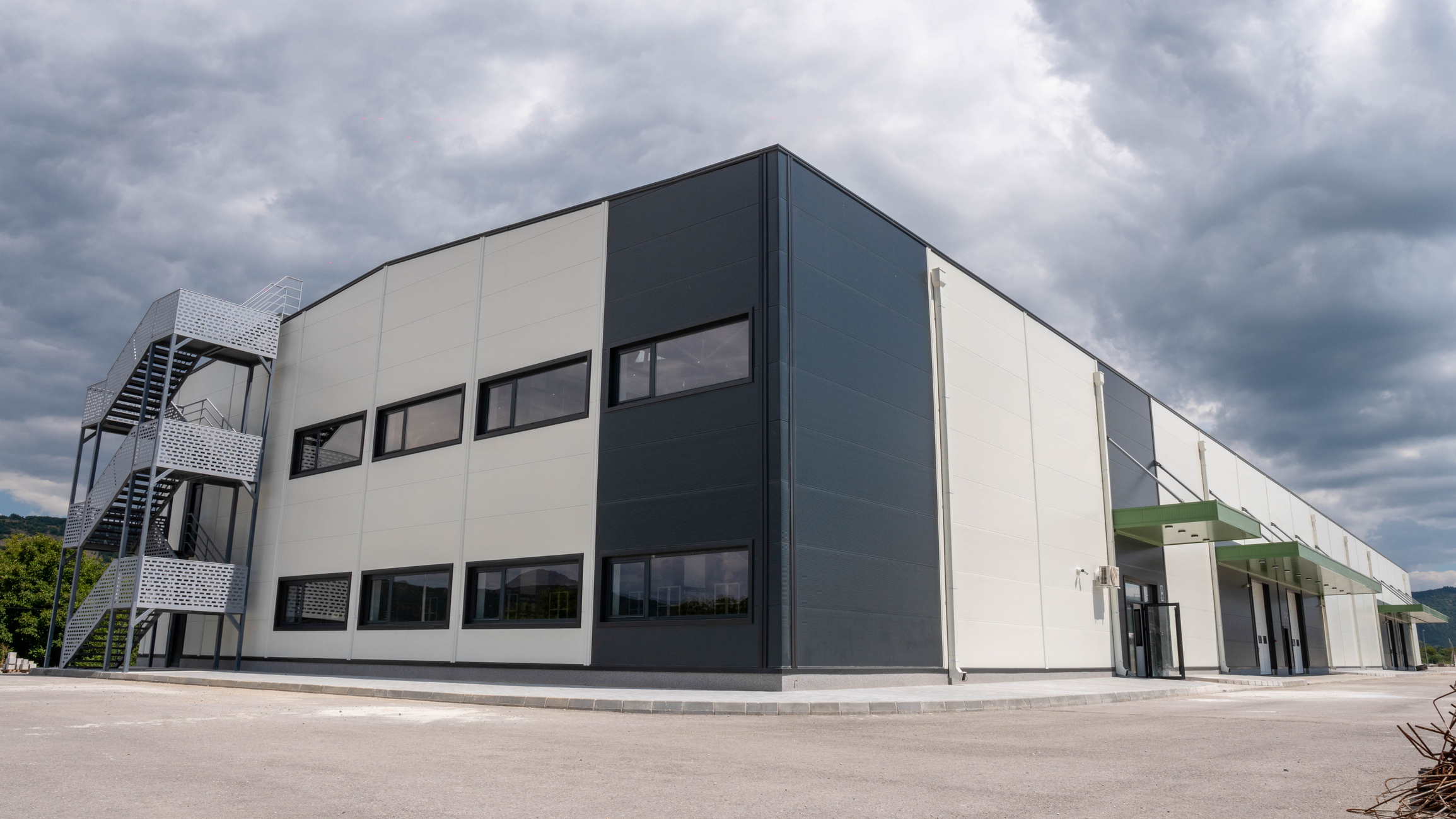 Drone view of metal warehouse with windows