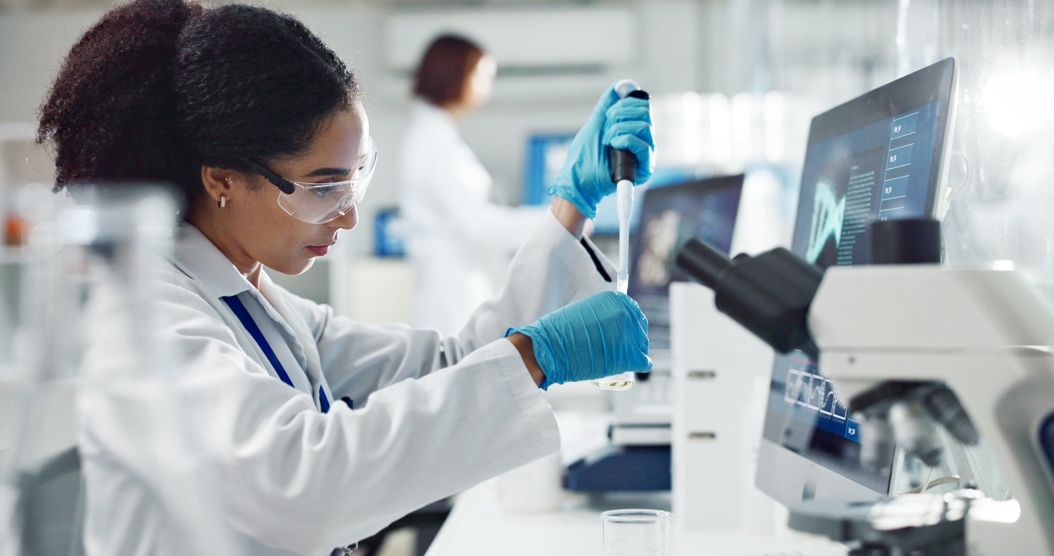 Female scientist in laboratory doing research and experiment